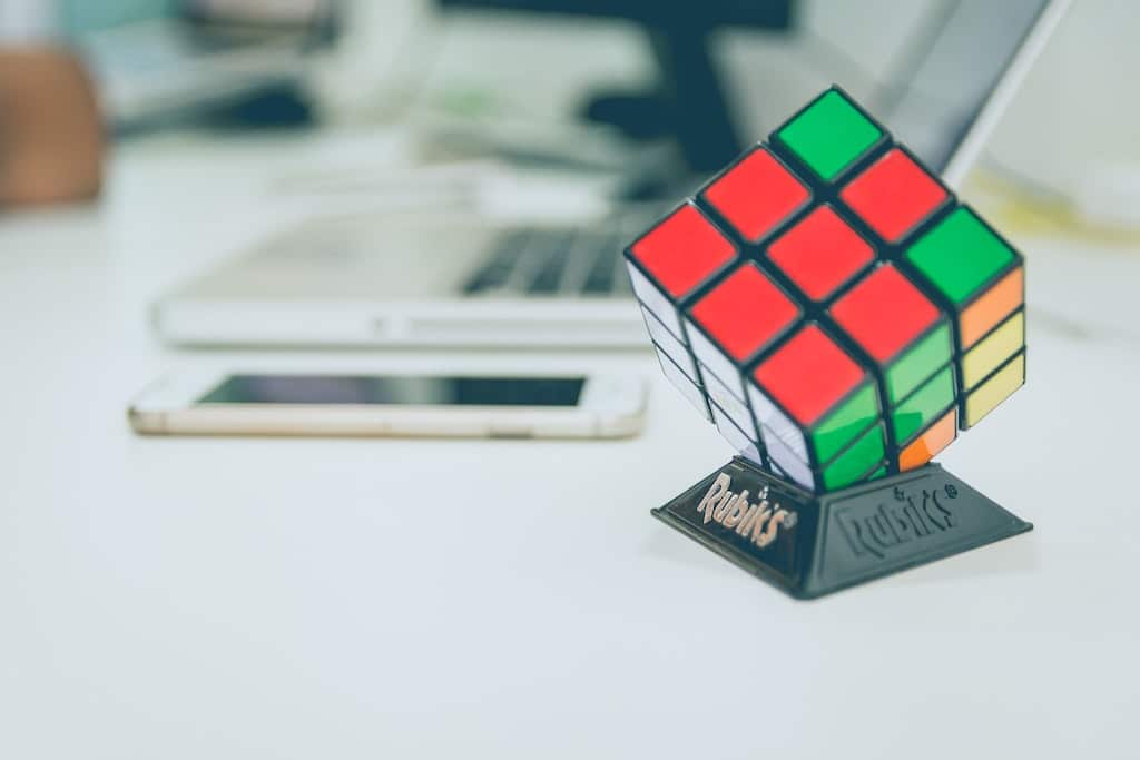 rubicks cube on desk, how psychedelics work in the brain