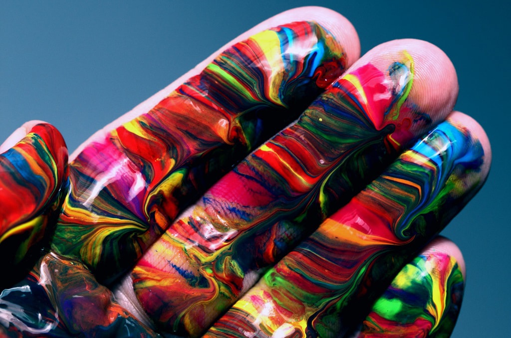 rainbow painted hand, benefits of waiting to use psychedelics