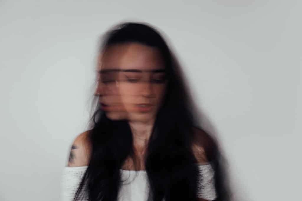 blurry picture of woman, how psychedelics can help treat anxiety